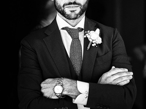 alt=the groom waits in front of the Brown Castle in Portofino, destination wedding