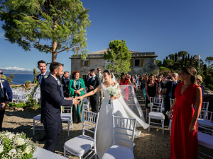 alt=Wedding ceremony at Castello Brown with panoramic Ligurian Sea view