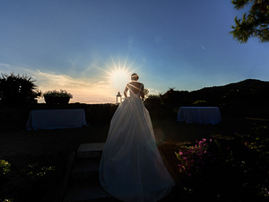alt=Romantic portrait of the bride at sunset at Castello Brown, Portofino