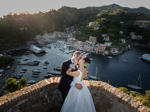 alt=Romantic couple portrait at sunset at Castello Brown, Portofino,destination wedding itraly