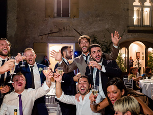 alt=toast to the newlyweds at the wedding at Castello Brown in Portofino