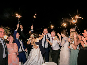 alt=Wedding cake cutting with panoramic sea view in Portofino destination wedding italy