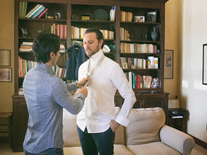 alt=groom getting ready with his best man