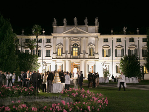 alt=the newlyweds at the reception at Villa Mosconi Bertani
